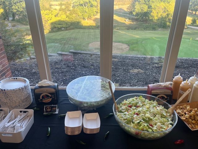 Catering buffet spread overlooking golf course